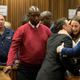 Pistorius says goodbye to his siblings before being led to prison.